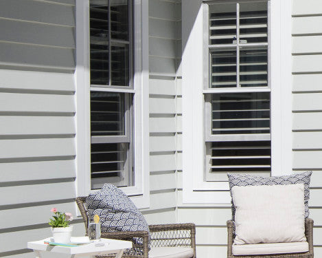 axent trim around windows on weatherboard planking with furnitire